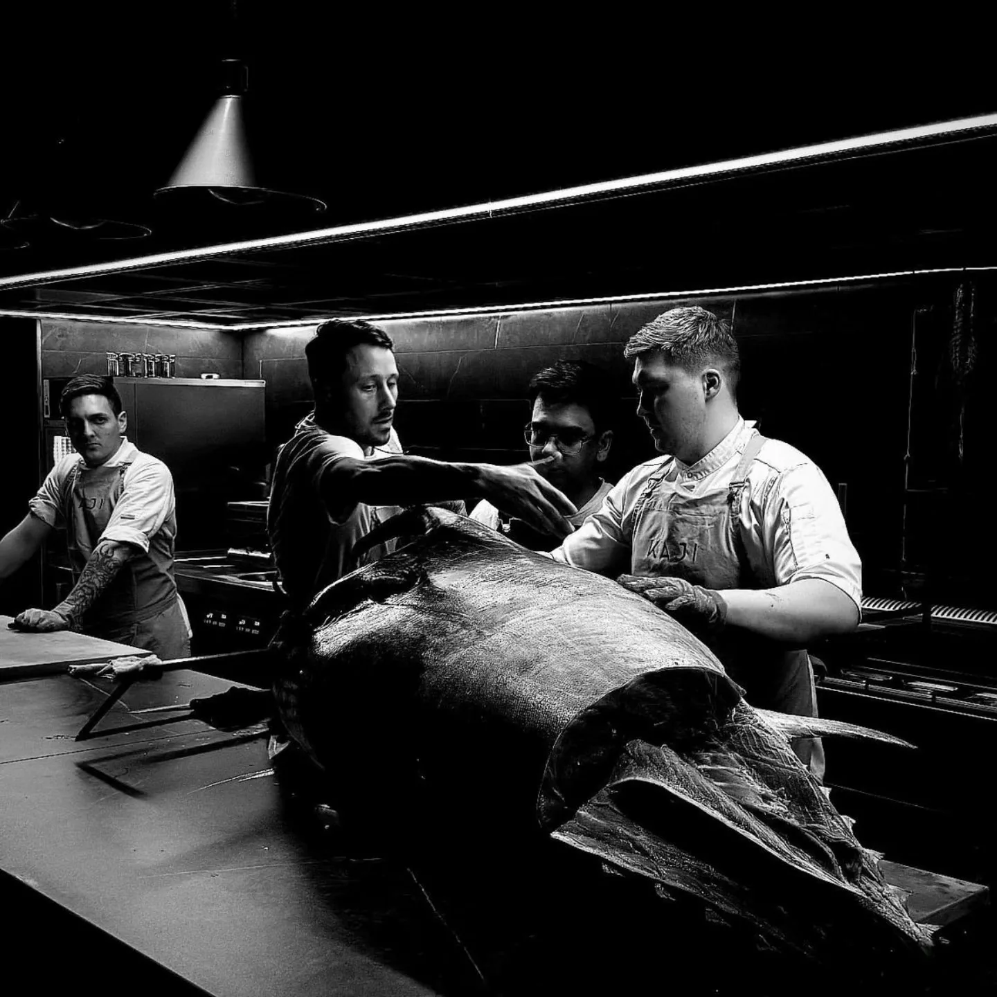 The team breaking down a whole bluefin tuna.